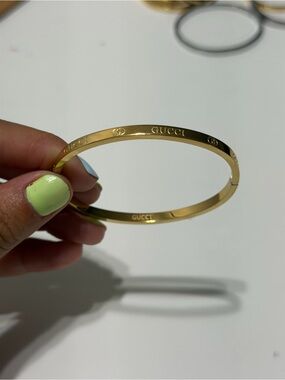 Gucci gold-tone logo bangle bracelet